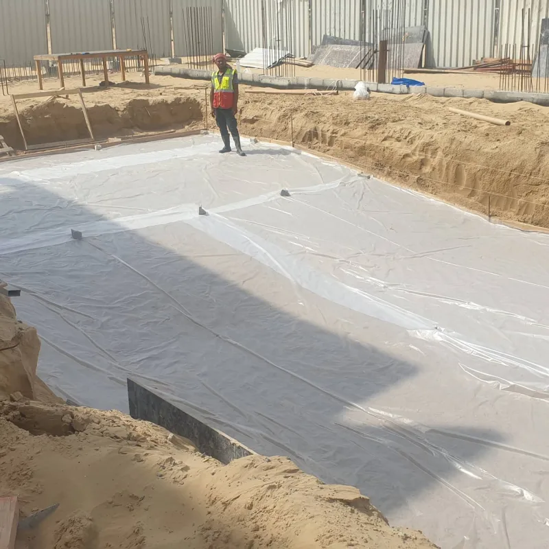 A waterproofing layer being laid over a pool base before tiling